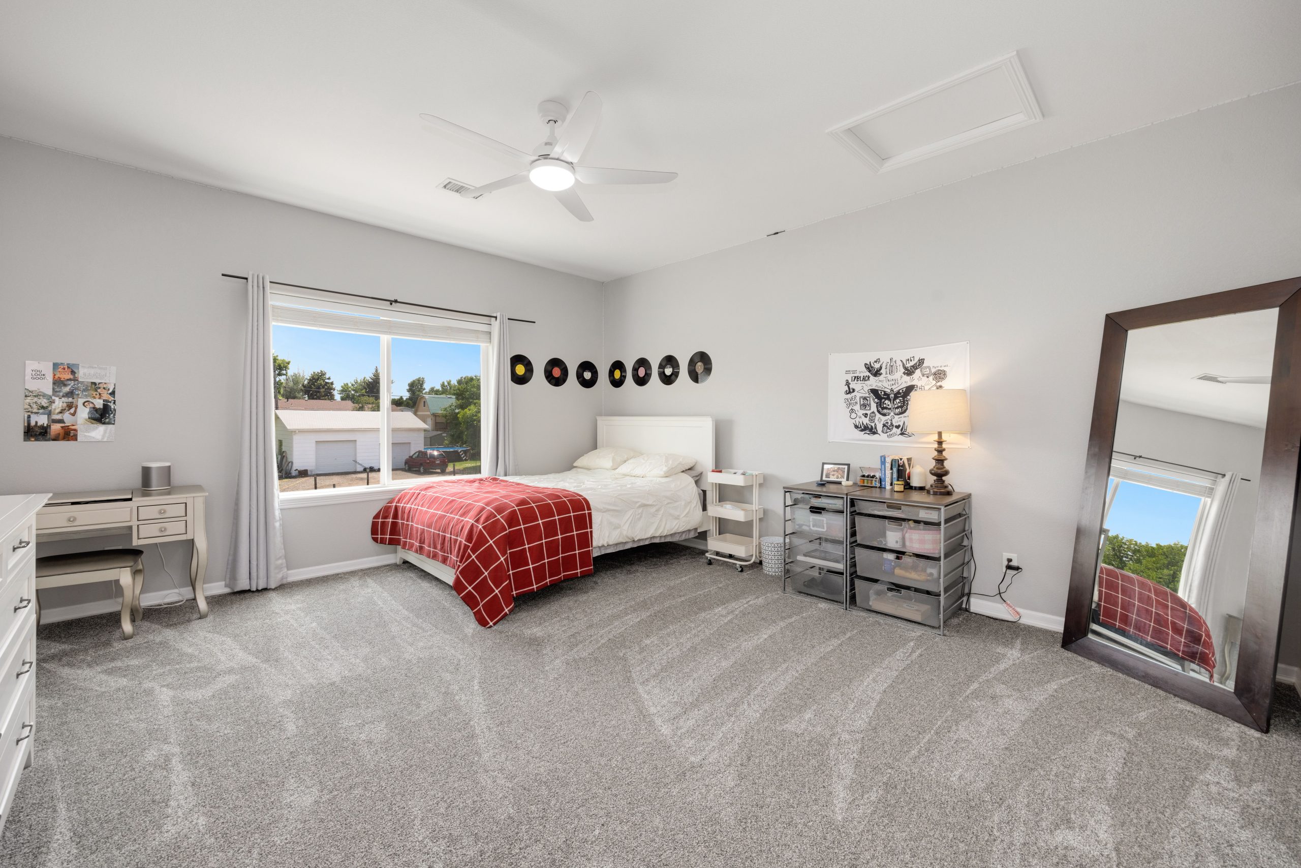 Cream wall-to-wall carpet in a bright Arkansas bedroom